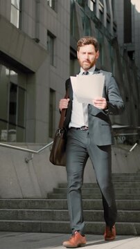 Businessman rereads terms of contract on way to meeting