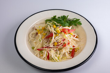 Fresh vegetable salad with cabbage, corn, bell pepper, and herbs. Perfect for healthy eating, summer lunches, and light dinners