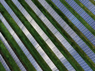 Aerial view of a solar farm producing clean renewable sun energy, industrial landscape