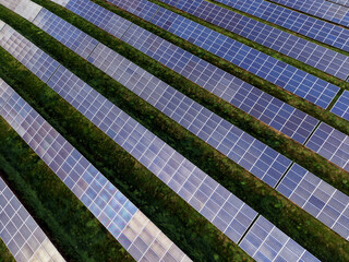 Aerial view of a solar farm producing clean renewable sun energy, industrial landscape
