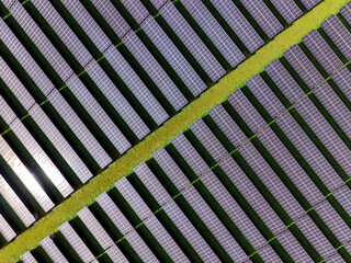 Aerial view of a solar farm producing clean renewable sun energy, industrial landscape