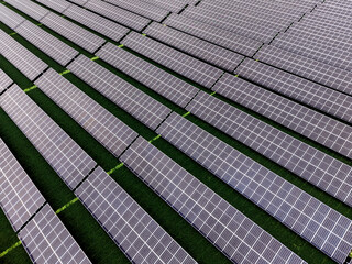 Aerial view of a solar farm producing clean renewable sun energy, industrial landscape