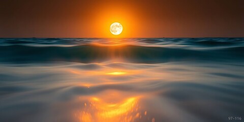Long exposure of ocean waves under a blazing orange sunset or sunrise. The sun's reflection streaks across the blurred water, creating a serene, vibrant seascape.
