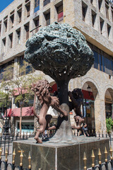 Guadalajara, Mexico - February 23 2025: Bronze sculpture of Guadalajara coat of arms featuring two lions and a tree in the historic center of the city