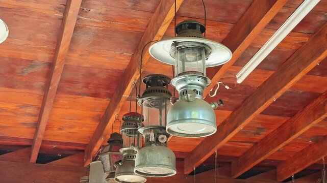 The paraffin lamps (hurricane lantern) hanging on the shoulder pole under the ceiling 