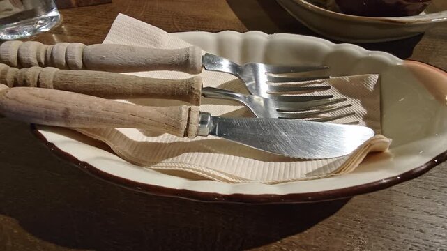 Set of spoons and knives in a plate