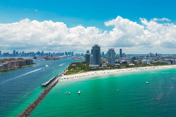 Obraz premium Miami cityscape with luxury skyscrapers and ocean. Panoramic drone view of Miamis famous skyline. Miami Beach from above. Miami skyline from top. Aerial cityscape of Miami, Florida.