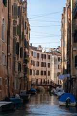 Venetian Canal with Boats and Hanging Laundry