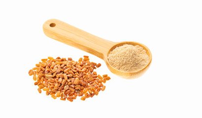 Dried, organic fenugreek seeds in a measuring spoon - Methi Dana