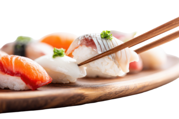 Close-up of sushi platter.  Chopsticks are lifting a piece of fish sushi.  Various types of sushi, including salmon, tuna, and possibly white fish. Wooden platter