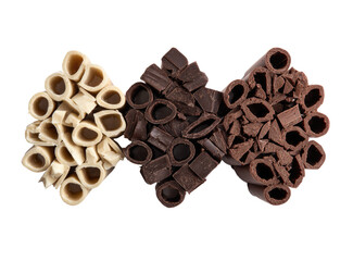 Three triangular clusters of fragmented, different-colored chocolate, arranged vertically.  Light beige, dark brown, and dark brown/black chocolate pieces are shown