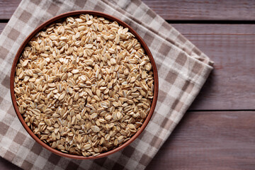 Whole Oats in Ceramic Bowl on Checkered Cloth Top View Copy Space