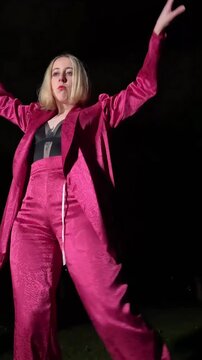 Professional dancer performing waacking at night