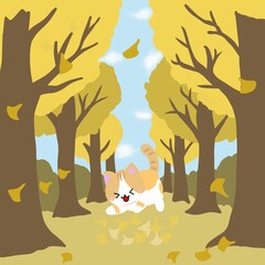 猫が落ち葉が舞う並木道（イチョウ並木）落ち葉の上でじゃれている