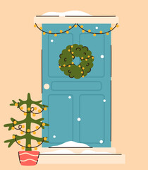 A door decorated with a Christmas wreath.