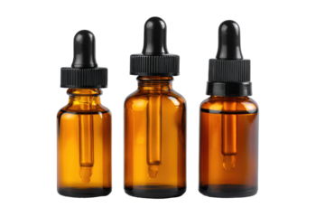 Three amber glass dropper bottles of varying sizes, filled with a clear liquid.  Black droppers
