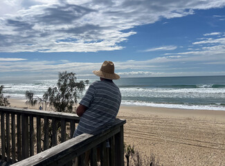 Senior adult Australian man looking at sea view