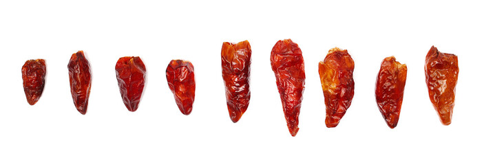 Set dried bird's eye chili peppers isolated on white background, top view