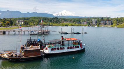 Aerial view of the port of the city of Pucón, with the imposing Villarrica volcano in the background.