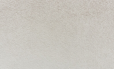 Textured abstract texture of a light gray concrete wall.