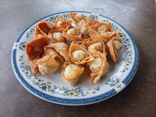 Fried chicken filled dumplings served on a plate