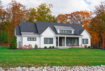 residential luxury house with colorful autumn trees