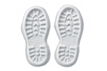 White snow boot steps leaving footprints, cold winter shoe tracks, isolated on transparent background, symbolizing journey and exploration
