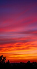 Obraz premium An exceptionally vibrant twilight sky explosion of orange, pink, purple, and red hues during the magical hour just after the sun descends ,twilight ,vivid ,dusk