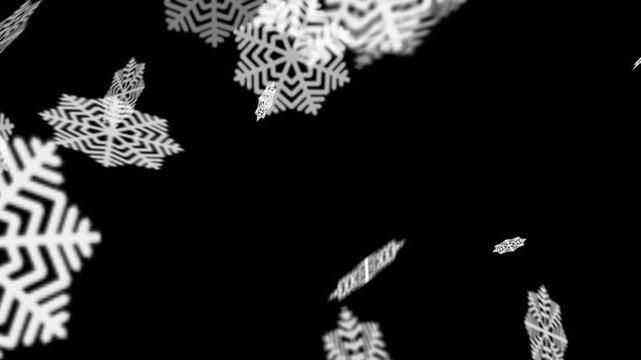 Animated falling snowflakes on a black background. A simple winter animation representing Christmas, cold season, or festive atmosphere with soft, rotating snowflake motion. Alfa channel