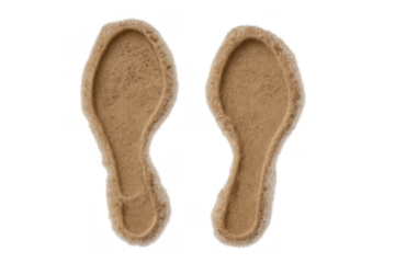 Footprints of a person walking on soft sand, creating impressions, isolated on a transparent background, representing summer vacations