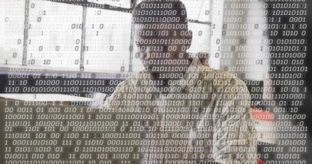 Typing software developer entering code on computer at desk in office, with binary code, copy space