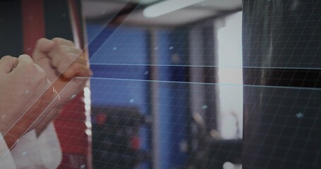 Martial artist wearing white sleeves and wraps punching heavy bag in gym, grid overlay, copy space