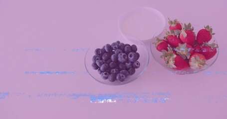 Presenting three glass bowls on kitchen countertop, with blueberries, strawberries, and yogurt © vectorfusionart
