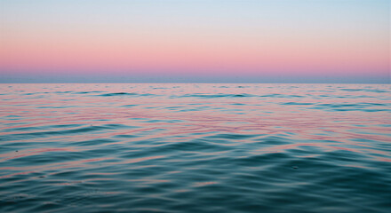 Fototapeta premium Tranquil ocean waves at sunset with soft pastel colors 
