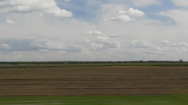 day time plowed harvest field landscape road trip passenger side window pov panorama 4k