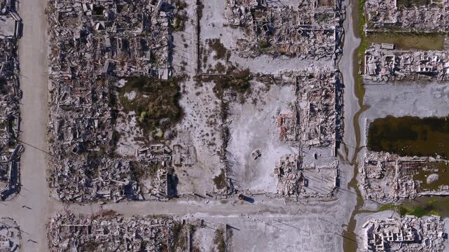 Top-down drone view of the flooded ruins and streets of Epecu&eacute;n ghost town in Buenos Aires province, Argentina.