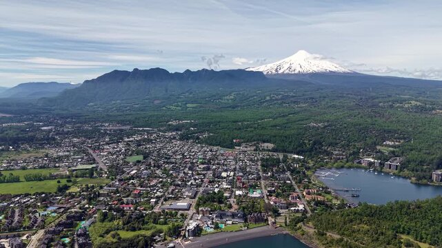 Aerial view of the city of Puc&oacute;n, in southern Chile. The Villarrica Volcano can be seen in the background.