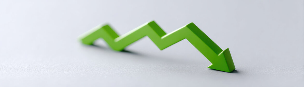 Green arrow graph showing decline and downward trend symbolizing economic or business decrease