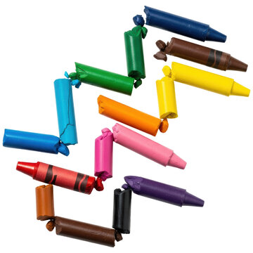 Colorful collection of broken and used wax crayons scattered for artistic projects