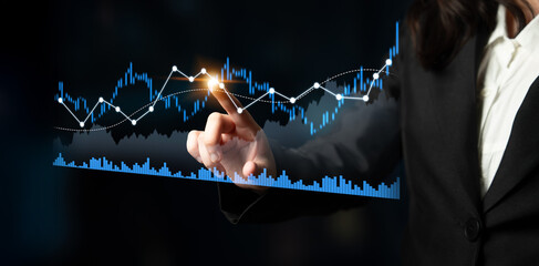 A business professional engages with a digital interface, analyzing financial data through interactive graphs and charts in a modern corporate setting. Scalp