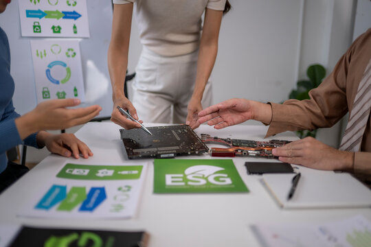 Business team discussing e-waste recycling strategy esg meeting