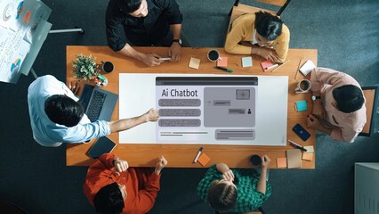 A group of diverse professionals collaborates on an artificial intelligence chatbot project in a modern office, emphasizing teamwork and innovative ideas. Raster