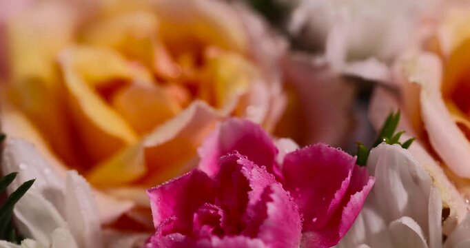a beautiful gift arrangement of a large variety of flowers , a flower arrangement for giving from different colors and different types of flowers
