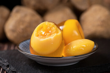 close up of preserved chicken eggs on table.