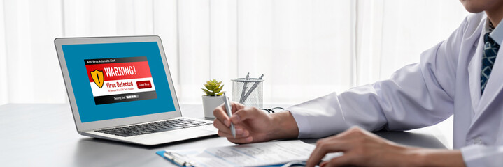 Virus warning alert on computer screen detected brisk cyber threat , hacker, computer virus and malware