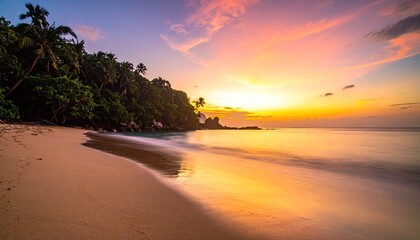 Tropical Beach Sunrise with Palm Trees and Calm Ocean Waves reflecting vibrant orange and pink sky illuminating sandy shore and lush green foliage in a serene natural landscape