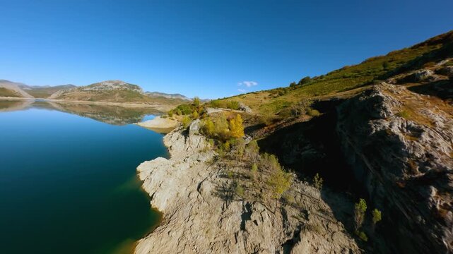 Aerial drone view of Picos de Europa reservoir in fall