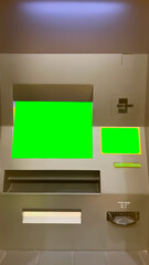 Close up view ATM cash machine with green screen background. 