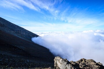 Gazing Above the Clouds from Mount Fuji's Volcanic Slope