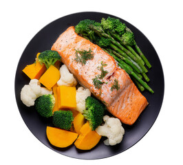 salmon steak with vegetables on black plate.